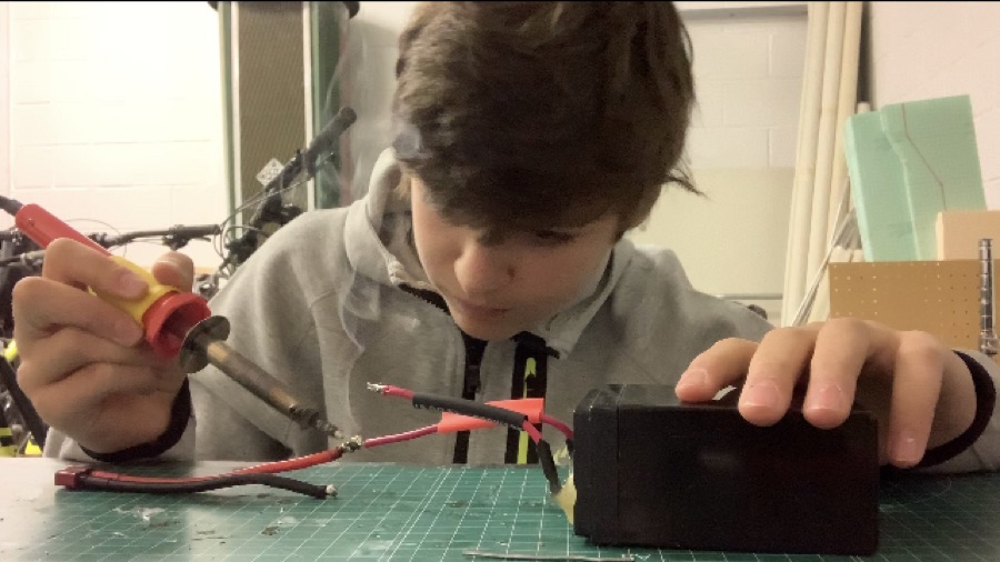 Marcel soldering a battery pack